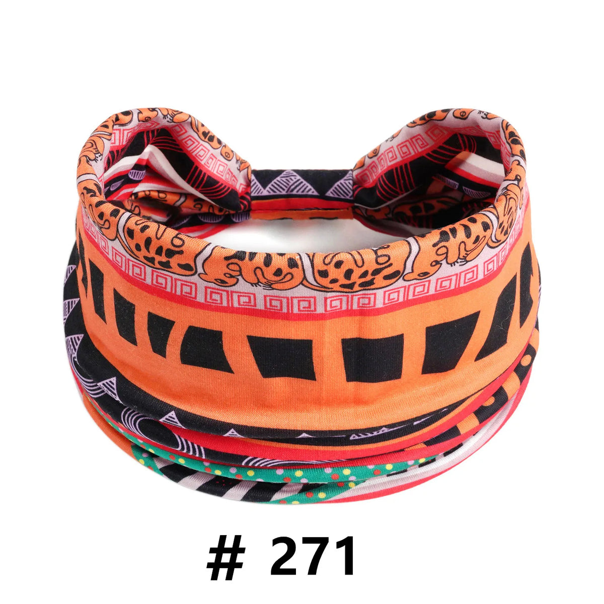 A colorful patterned boho cotton turban headband rolled up, featuring orange, black, and leopard print designs.