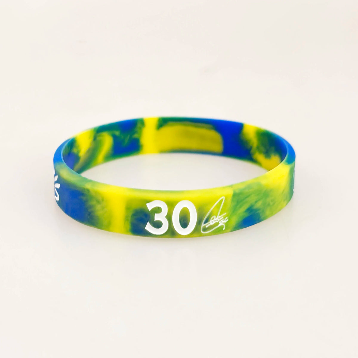 A yellow and blue marbled silicone wristband with the number 30 on it.