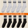 A collection of ten pairs of breathable cotton sport socks in gray and black colors.