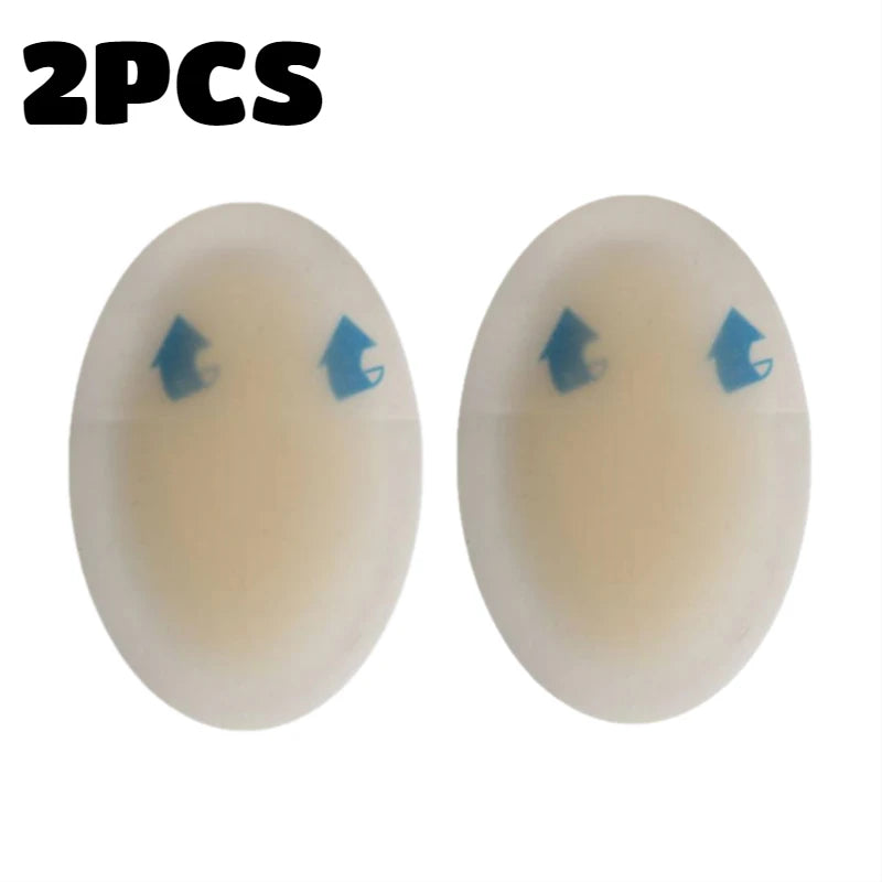 Two clear silicone blister patches with blue arrows on the surface for foot protection