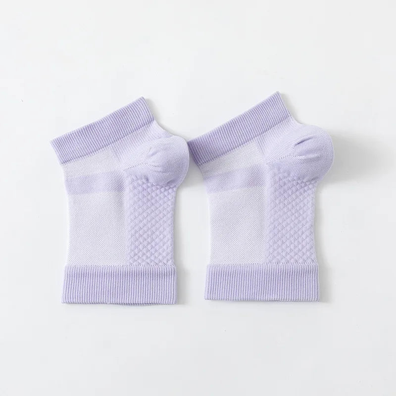A pair of light purple therapeutic compression socks for foot and ankle pain relief.