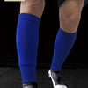 A pair of blue soccer leg protectors and cleats are shown on a person's legs.