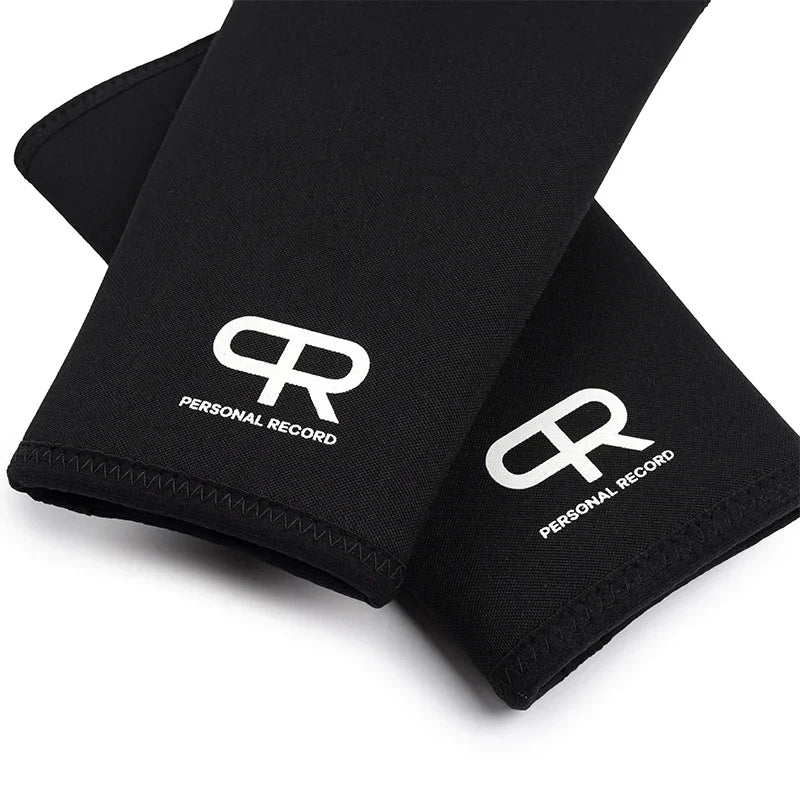 Black neoprene knee pads with a white 'R' logo and personal record text shown diagonally.