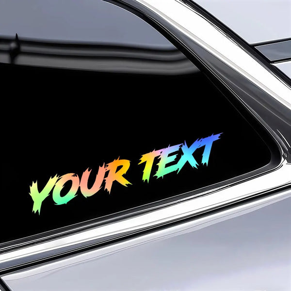 A close-up shot of a custom text decal sticker applied to a shiny silver car or motorcycle surface.