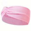 Pink knotted elastic sports headband worn on a person's head