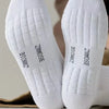 Pair of white breathable sports performance socks viewed from the bottom