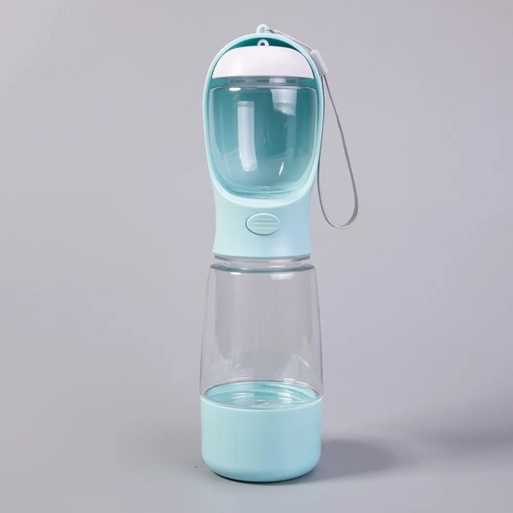 A light blue 3-in-1 portable pet water and food dispenser with a clear container and a white top.