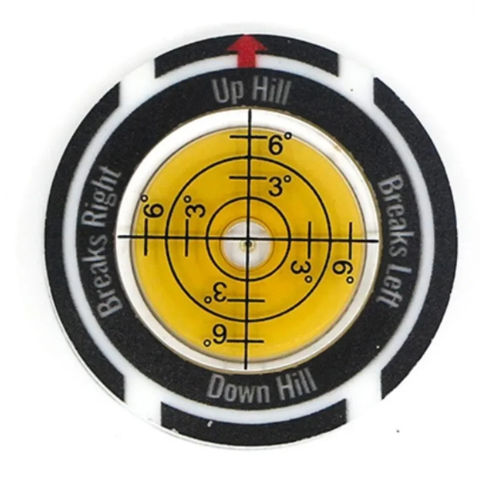 A circular golf ball marker and slope meter with a black and white design showing directional markings for up hill and down h