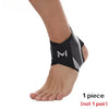 A black knit ankle brace with a gray mesh pattern is worn on a person's foot and ankle.