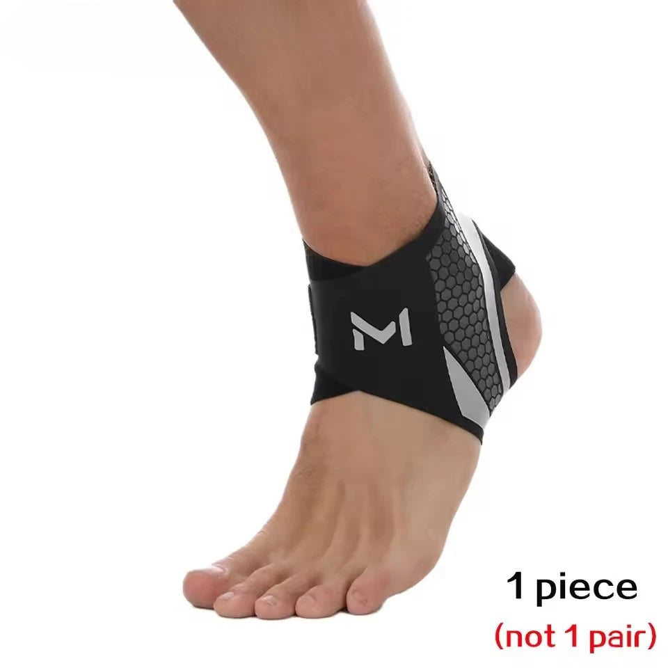 A black knit ankle brace with a gray mesh pattern is worn on a person's foot and ankle.