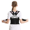 A woman models an adjustable posture back brace support with black and white accents.