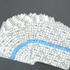 A fan of white invisible leg lifting patches arranged in a fan shape.