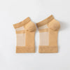 Pair of beige therapeutic compression socks for foot and ankle pain relief