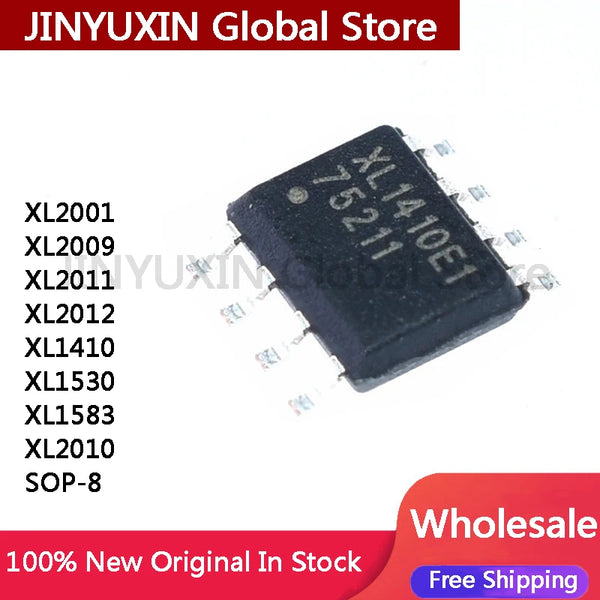 A collection of various XL series precision voltage regulator IC chips in black epoxy packages.