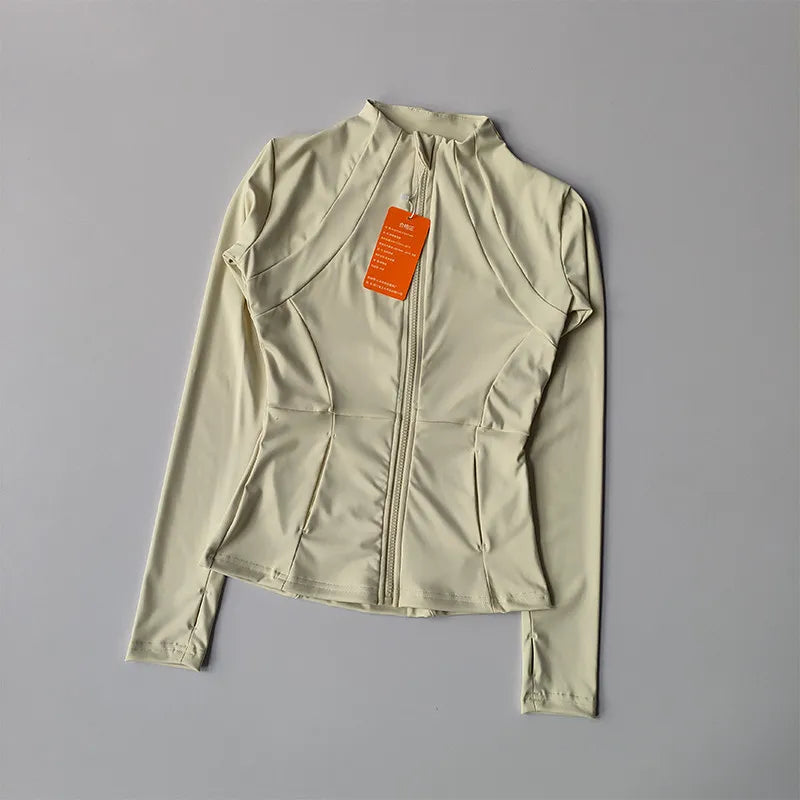 A light beige quick-dry yoga and fitness jacket shown flat lay.