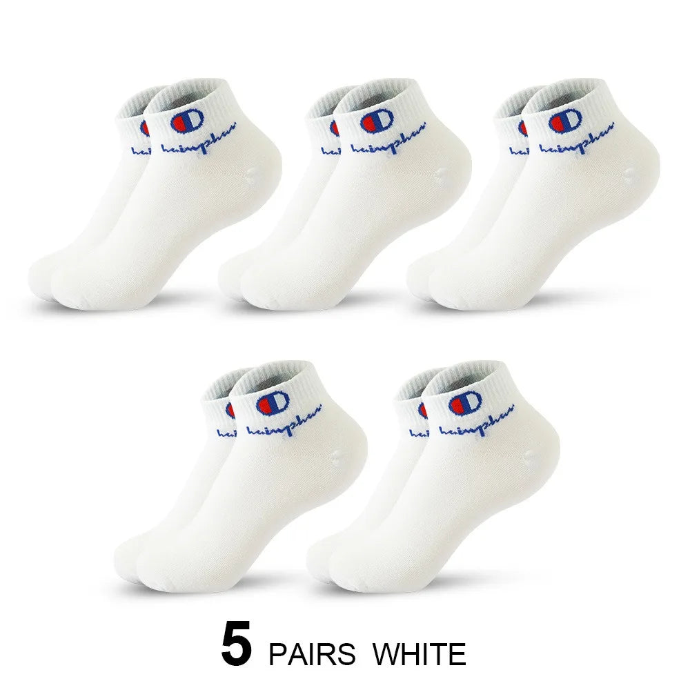 Five pairs of white ankle socks with blue and red embroidery