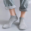 Gray unisex thin ankle socks folded and displayed on a light gray surface.
