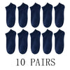 Ten pairs of navy blue comfort fit ankle socks laid out in a row.