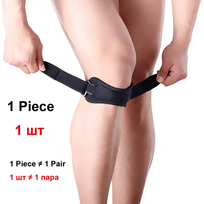 Black adjustable patella tendon support brace worn on a person's knee.