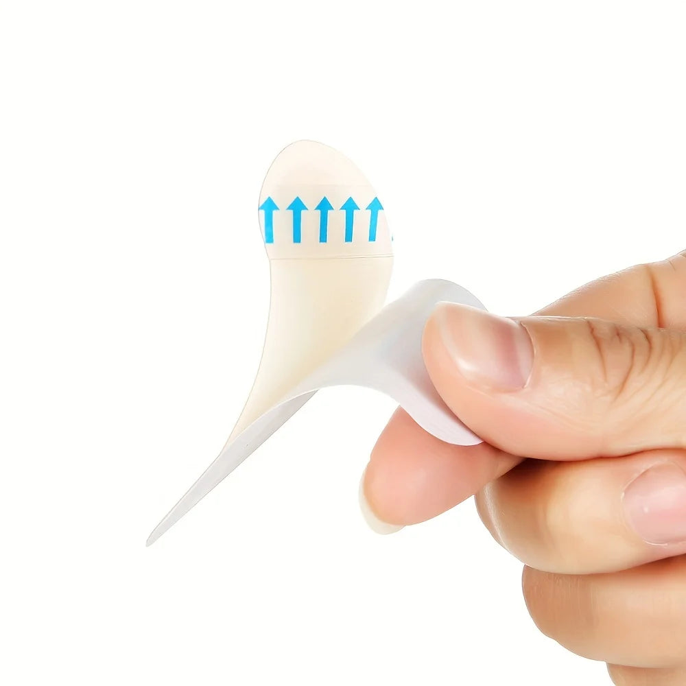 A hand holds an invisible silicone blister patch with blue arrows indicating pressure points on the skin.