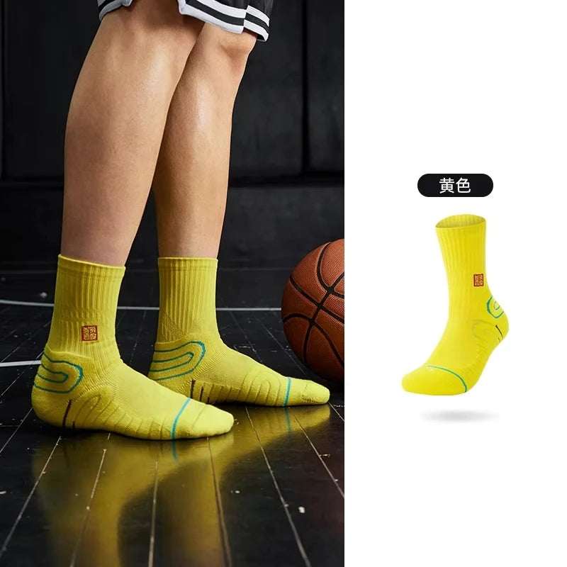 Yellow performance basketball running socks shown on a person's leg and isolated for detail.
