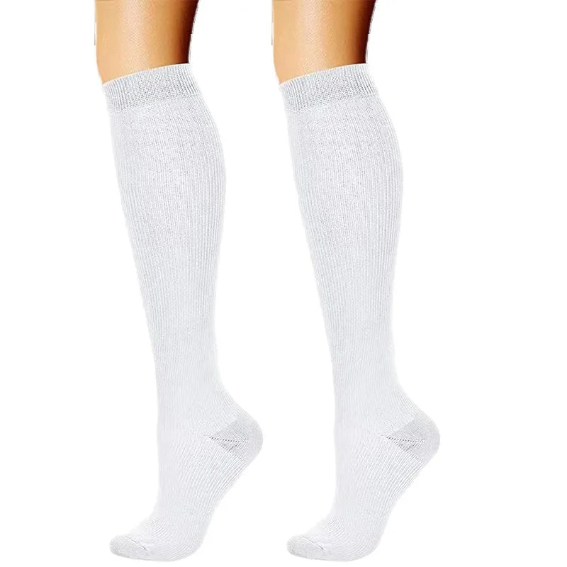 Pair of white compression elastic socks for sports and daily wear