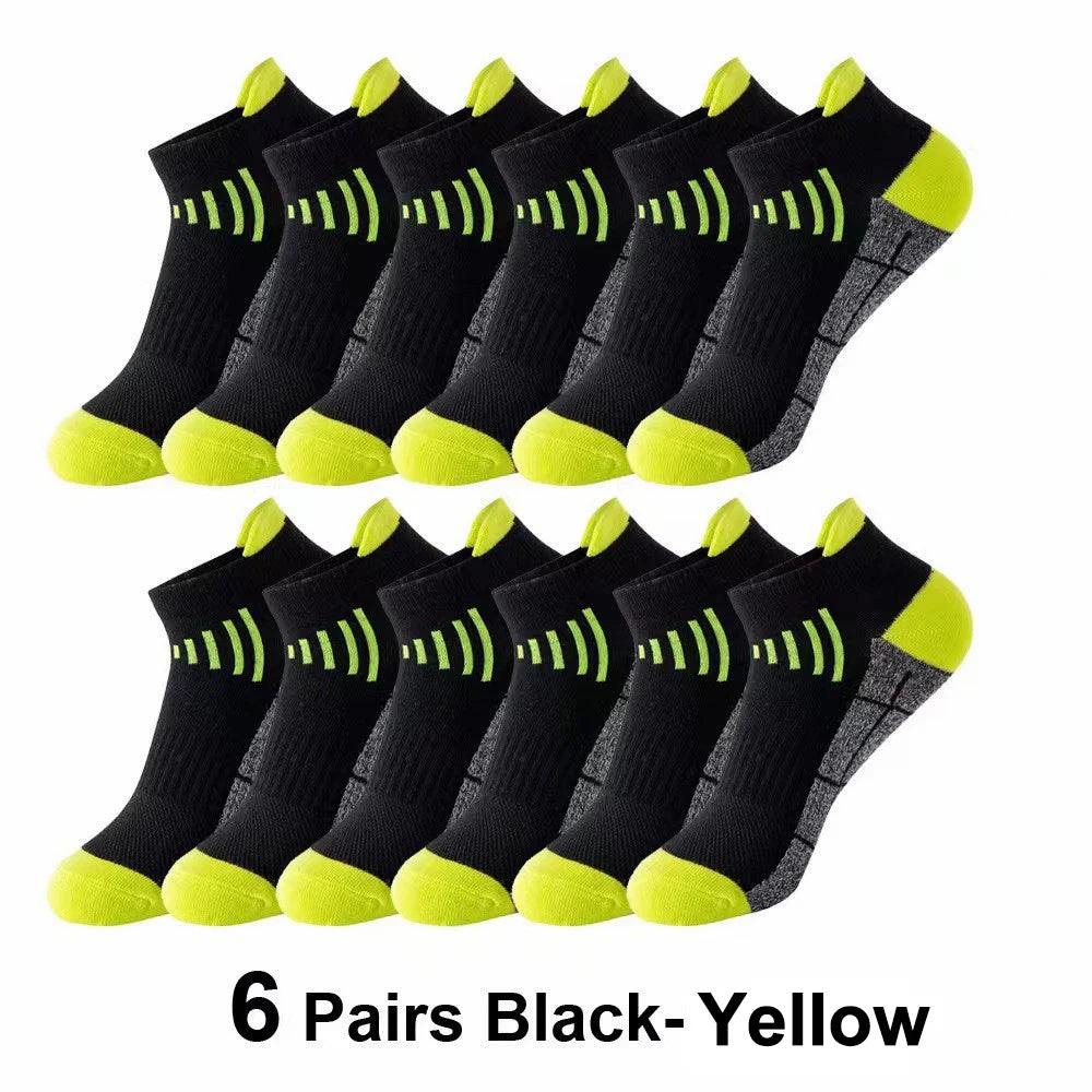 Six pairs of black and yellow knit sports socks displayed in a row.