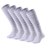 A row of white knee-high sports socks laid out flat.