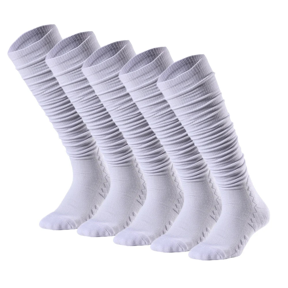 A row of white knee-high sports socks laid out flat.