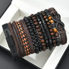 A collection of dark and light brown beaded leather bracelets arranged in a box.