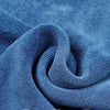 Close-up of a blue microfiber towel showing fine weaving texture and precision overlock stitching.