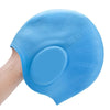 A hand is holding a light blue waterproof silicone swimming cap designed for long hair.