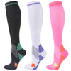 Three pairs of medical grade compression socks in black white and pink showing different patterns