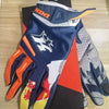A pair of heavy duty full finger off-road motorcycle gloves in blue, orange, and gray.