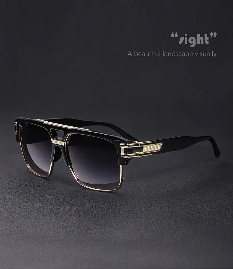 A pair of black sunglasses with gold accents resting on a dark surface.