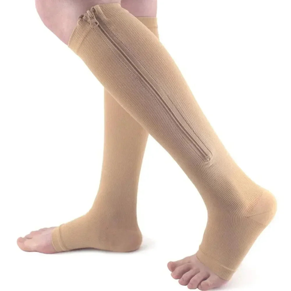 Tan compression stockings covering the legs and feet.