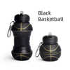 Black basketball with gold stitching and a cap shown against a white background.