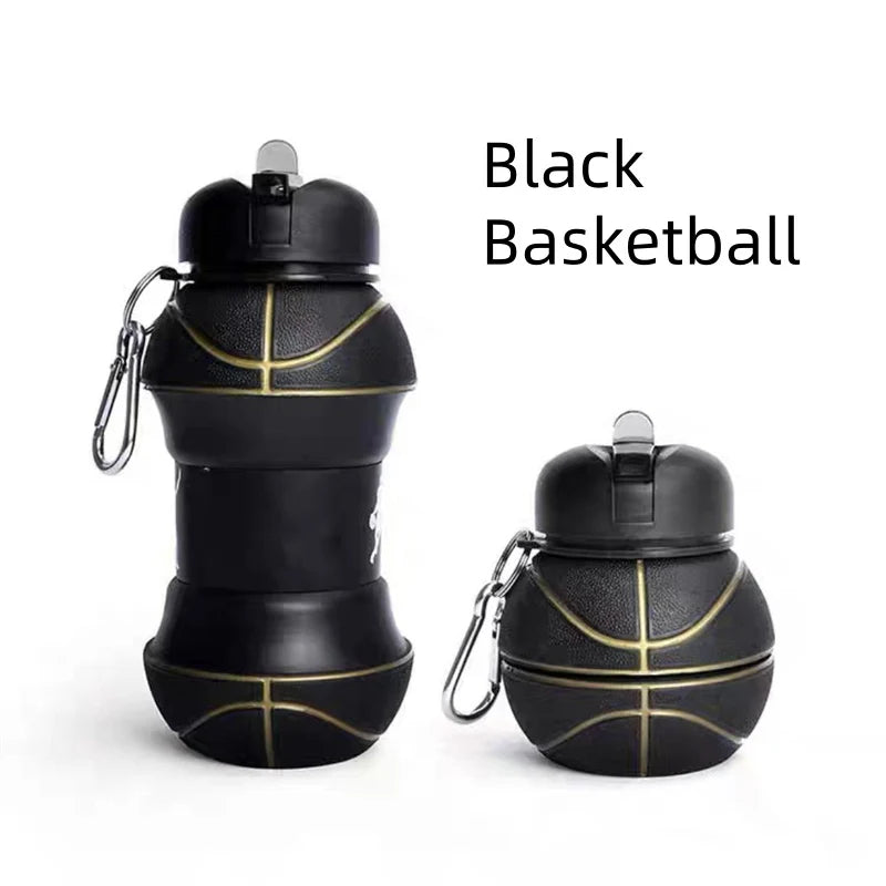 Black basketball with gold stitching and a cap shown against a white background.