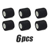 Six black elastic tattoo grip tapes rolled for finger and wrist protection
