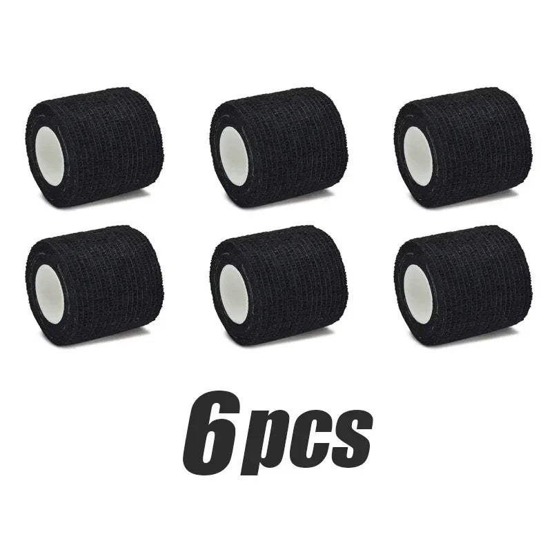 Six black elastic tattoo grip tapes rolled for finger and wrist protection