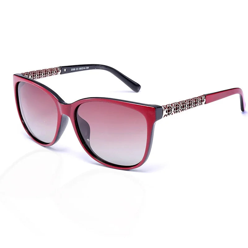 Red-framed cat eye polarized sunglasses with a patterned detail on the temples