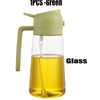 A green glass oil sprayer bottle with a spout is shown.