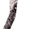 A long seamless tattoo sleeve featuring a detailed skull design in black and gray ink.