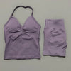 A lilac women's seamless fitness set consisting of a cropped top and matching shorts.