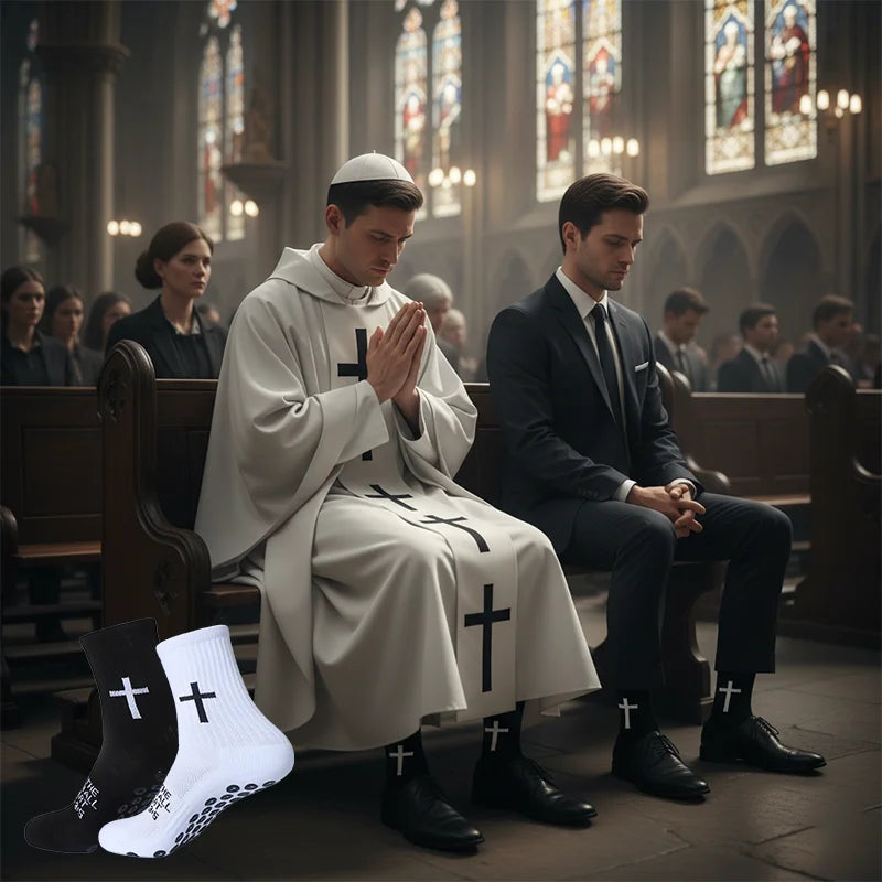 A man in a white monastic robe sits beside another man in a suit, both wearing black and white sports socks with crosses.