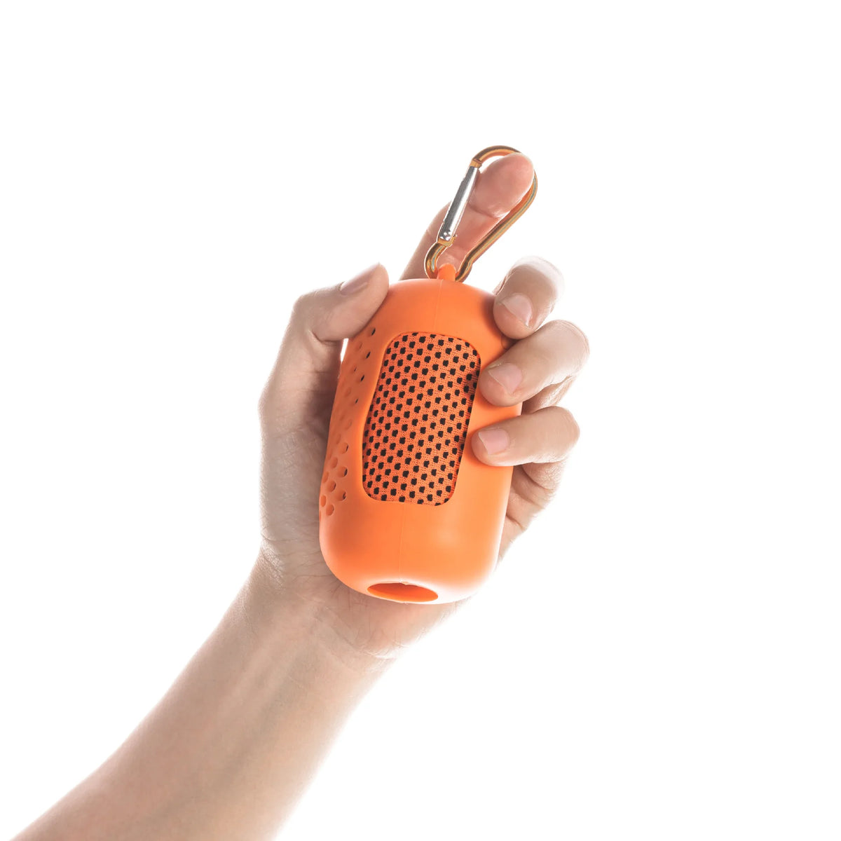 A hand is holding an orange instant cooling towel with a metal clip against a white background.