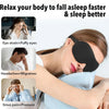 A woman is using a black memory foam sleep mask to relieve eye strain and headaches while trying to fall asleep.
