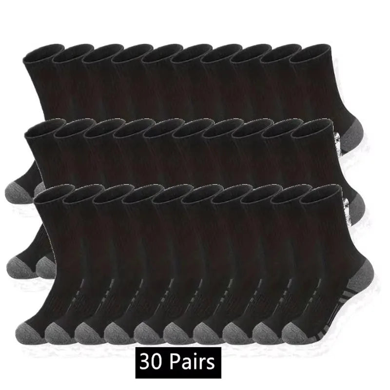 A stack of thirty pairs of black men's outdoor gym football socks.