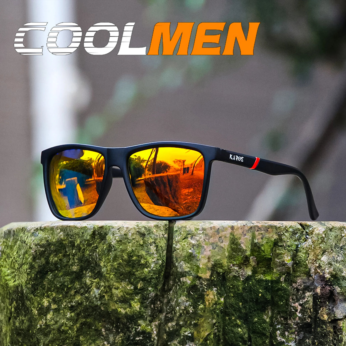 A pair of black polarized sunglasses with orange frames resting on a mossy green rock.
