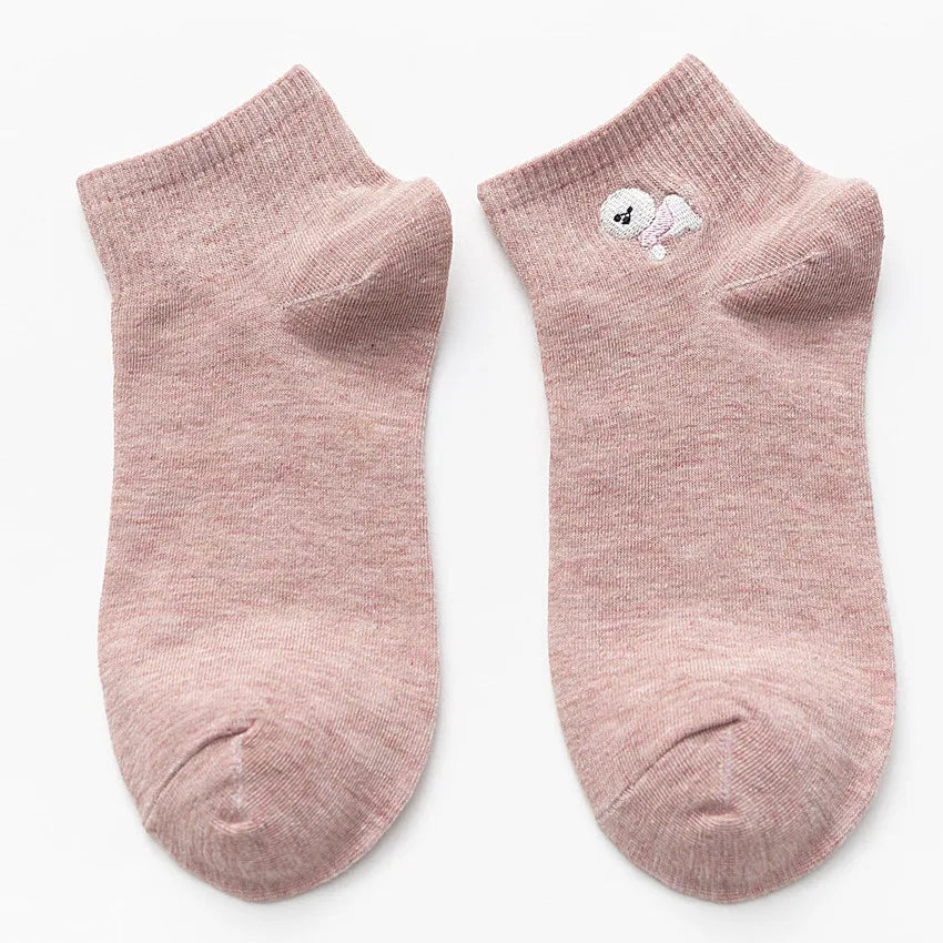 Pair of light pink cotton socks with a white embroidered bunny face